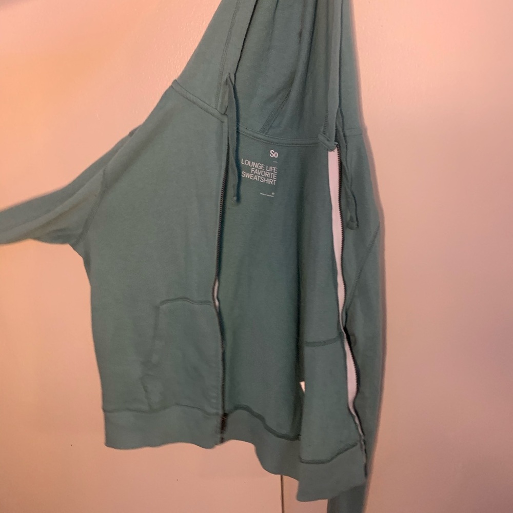 green zip up